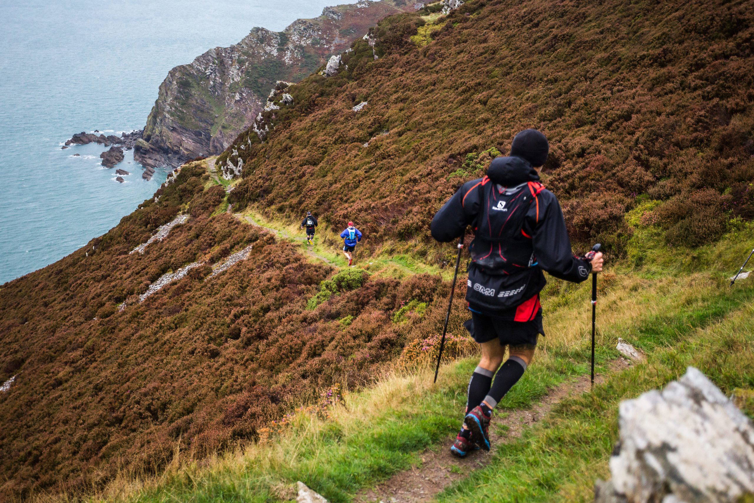 An image of a group of people hiking down a mountain.