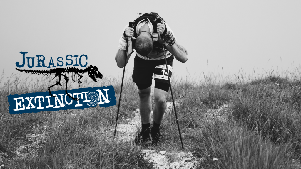 Jurassic Extinction. An image of an individual hiking over moors.